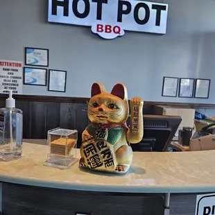 a cat statue on the counter