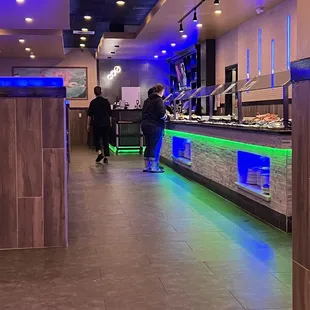 a man standing in front of a hot pot