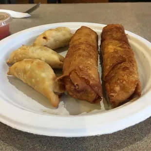 Appetizers pot stickers and egg rolls house mad