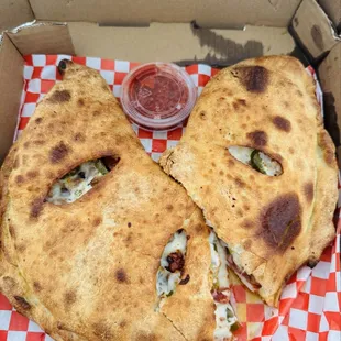 The calzone customized with Alfredo sauce (this is the normal size and it was so huge they had to cut it in half to fit the box )