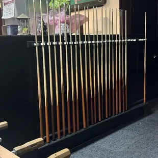 a billiards room with a pool table and billiards rack