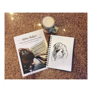 a book and a candle on a table