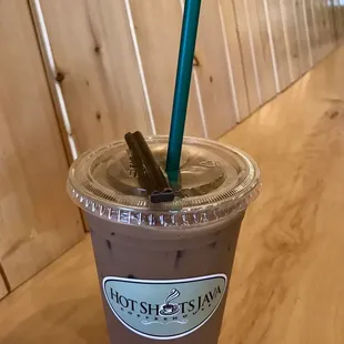 Decaf iced dark mocha with a complimentary chocolate stick.