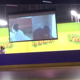 Large projector screen plays videos to accompany the music!