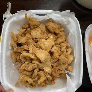 Fried Batter crumbs with a few pieces of chicken and a side of sriracha sauce. AKA Herbal Chicken