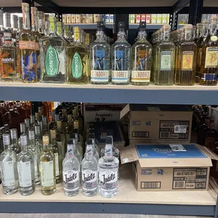 a shelf full of liquor bottles