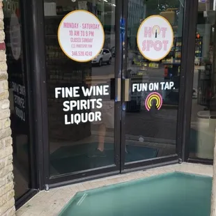 a hot tub in front of a wine shop