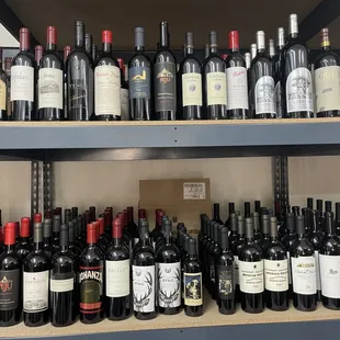a shelf full of wine bottles