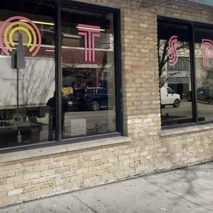 the reflection of a truck in the window