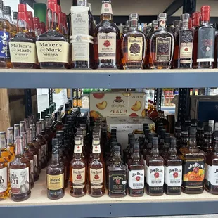 a shelf full of liquor bottles