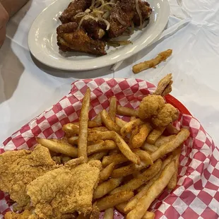 Fried fish and shrimp w/ cajun fries and wings w/ fish sauce.