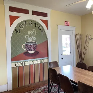 Cute art on the wall in the house converted into the Hot Spot Coffee shop