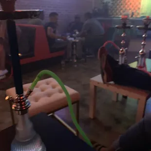a hookah bar with people sitting at tables