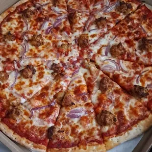 Large cheese 2 topping - Sausage and red onion.