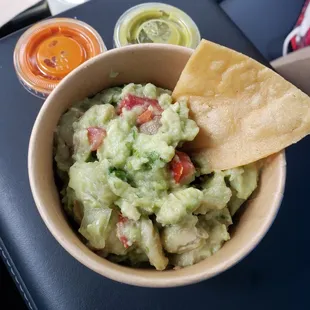 Guac and medium(green) and hot salsa in the back