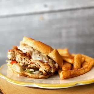 COACH RUIZ 
Grilled chicken, dressed with bacon, cheese, lettuce, tomato &amp; honey mustard on a croissant