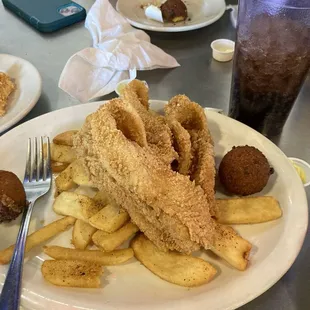 a plate of fried fish and fries