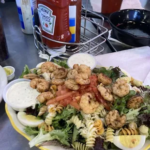 a plate of food with shrimp and pasta