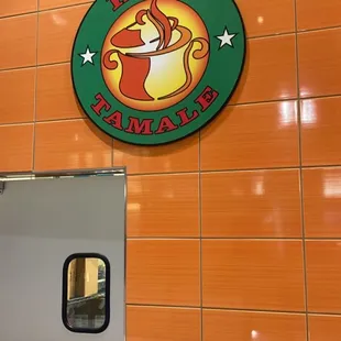 a sign for a hot tamale restaurant