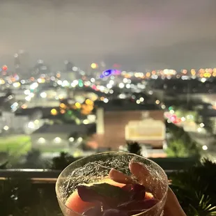 a person holding a glass of wine