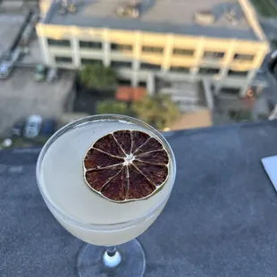 a grapefruit in a martini glass