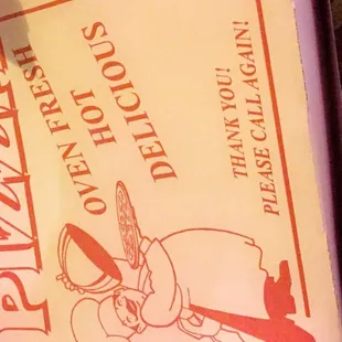 a pizza box with a knife sticking out of it