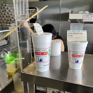 Fresh sugar cane sticks being juiced