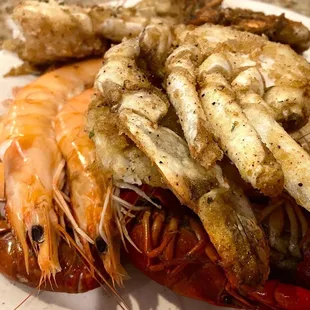 a plate of seafood and shrimp