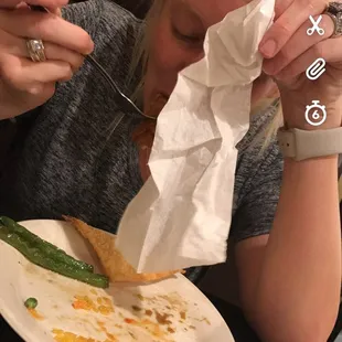 a woman eating a plate of food