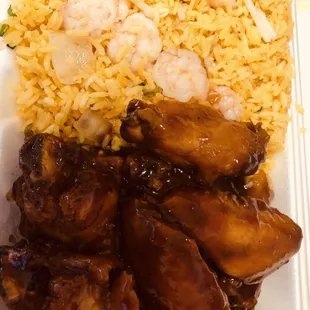 chicken wings and rice in a styrofoam container