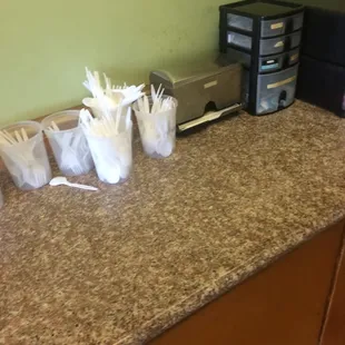 a kitchen counter with a microwave, toaster and toaster