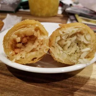 Inside of egg rolls,  nearly all bland cabbage! Boo... Left is pork,  right shrimp
