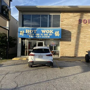 a car parked in front of a building