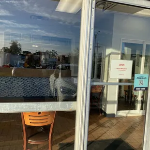 the reflection of a dog in the window