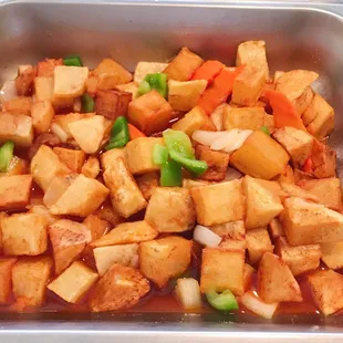 tofu and vegetables in a pan