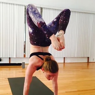 Kendra Rickert demonstrates "Scorpion" during Advanced Asana
