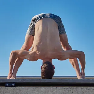 Standing separate leg stretching pose.