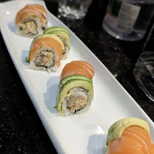 Tiger -  spicy crab meat, tobiko, scallop topped with salmon and avocado