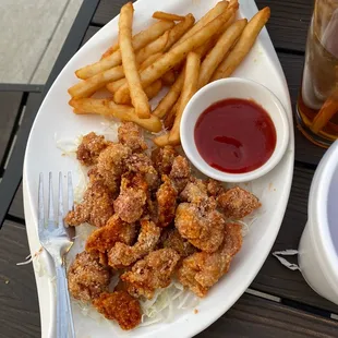 Kids meal chicken nuggets (flavored with a spice) and fries