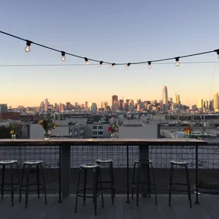 a view of the city from a rooftop bar