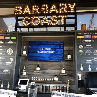 a bar with menus on the wall