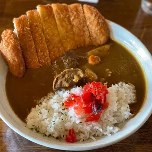  bowl of stew, rice, and bread