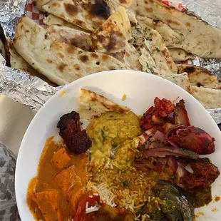 Chicken Tikka Masala, Yellow Daal, Mixed Grill, Aaloo Baigan, Chilli Paneer (Gravy), Basmati Rice and Bread Basket.