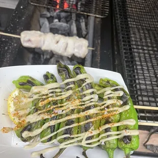 Grilled Shishitto pepper skewers w/ yuzu tahini dressing