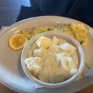 Spinach, bacon, &amp; Swiss omelette with grits