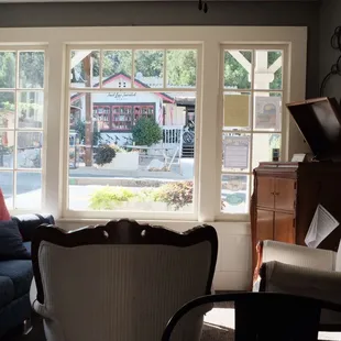 Interior view of the hotel lobby looking out at the Main Street of Groveland.