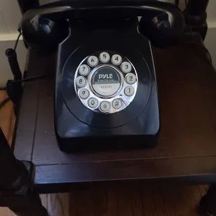 Cute old phone in our room and it works.