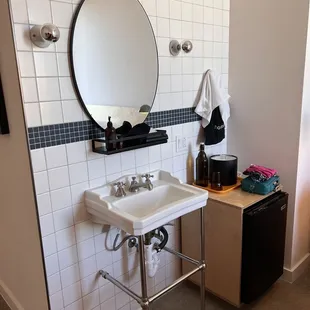 This is next to the bed in the standard room