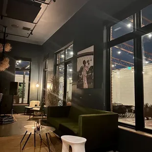 a living room with a green couch