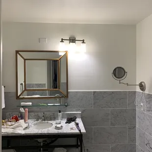 Light fixture poorly located. No power near vanity. Not what you expect for a high end boutique.